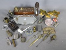 A mixed lot of collectables to include vesta cases, vintage lighters, brassware, set of weights,
