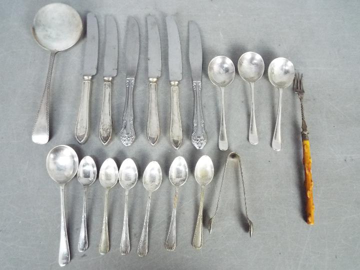 Lot to include four silver handled butter knives,