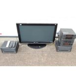 A Panasonic Viera 37" television,model TX-P37X10B and a JVC stereo system and speakers.