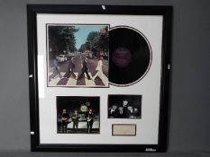 The Beatles - Framed autograph montage comprising two photographs,