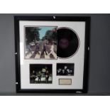 The Beatles - Framed autograph montage comprising two photographs,