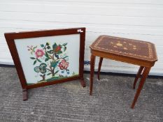 An inlaid side table with musical movement on sabre supports 56 cm x 50 cm x 37 cm and a wooden