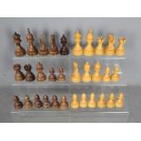 A good quality carved wood chess set with weighted bases and 9.5 cm king.