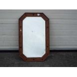 A wood framed, bevel edged mirror, appro