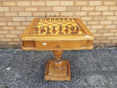 A chessboard table, approximately 66 cm