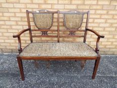 A twin bench seat with upholstery, appro