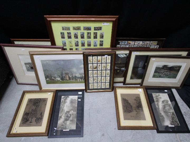 A collection of thirteen framed pictures