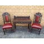 Two chairs with carved decoration and le