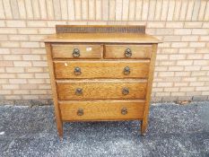 A chest of two over three drawers on cas