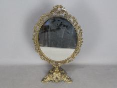 A ornate, brass framed dressing table sw