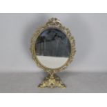 A ornate, brass framed dressing table sw