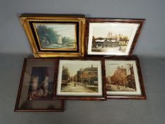 A small collection of framed prints.