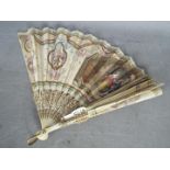 A decorative hand fan, size 22 cm