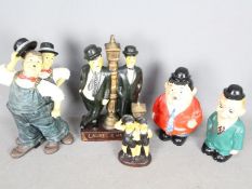 A collection of Laurel & Hardy figurines