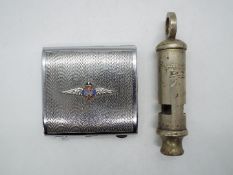 A square white metal compact with engine-turned cover applied with an enamel RAF badge, circa 1950s,