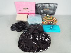 A collection of lady's evening bags, some still with tags, appear generally unused.