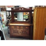 An oak mirror back sideboard, with carved Art Nouveau detail,