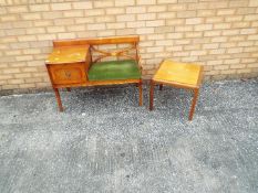 A telephone table incorporating green upholstered seat,