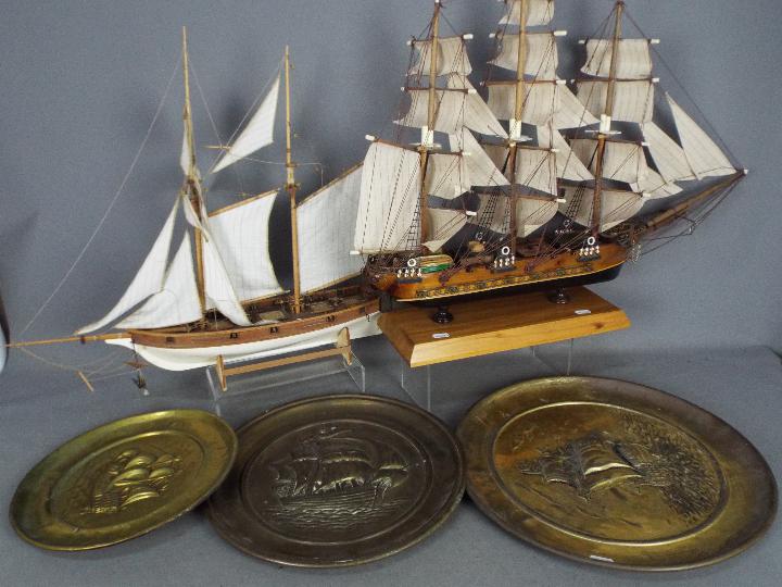 Two complete and comprehensive models of galleons of wood construction with original masts;