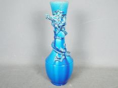 An Awaji pottery blue glaze vase with applied dragon around the neck, approximately 31 cm (h).