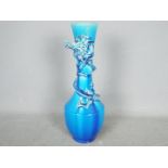 An Awaji pottery blue glaze vase with applied dragon around the neck, approximately 31 cm (h).