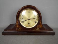 A Napoleons hat mantel clock with Chinoiserie decoration and Westminster chimes,