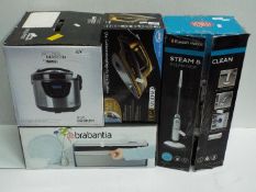 Four boxed household appliances comprising a Wahl James Martin multi cooker,