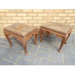 A pair of intricately carved Indian side tables measuring approximately 41 cm x 49 cm x 35 cm.