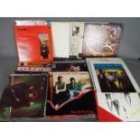 Approximately sixty 12" vinyl records comprising Jefferson Starship, Grace Slick, The Jam,