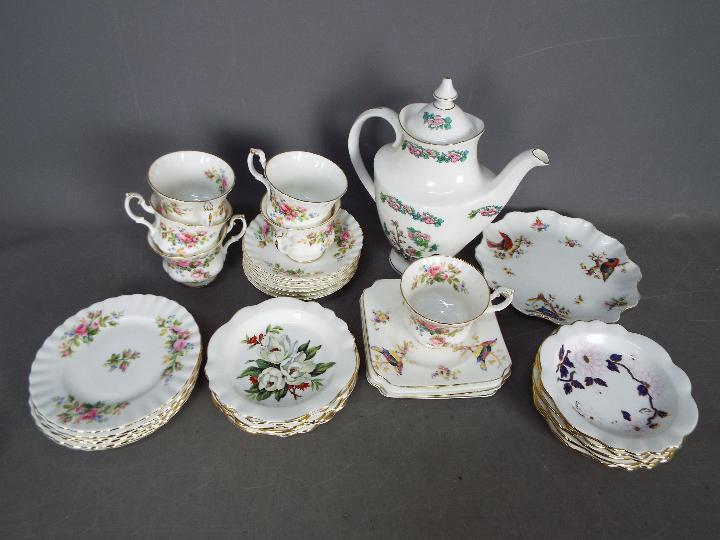 A small lot of mixed tea wares to include six Royal Albert 'Moss Rose' trios,