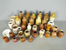 A collection of stoneware bottles and vessels, Sylvac 'Seahorse' shaving mug and similar.