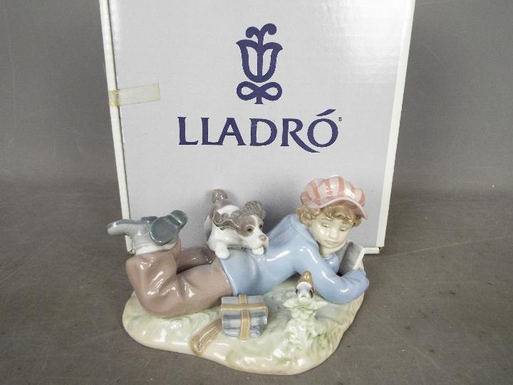 Lladro - A boxed figural group entitled Study Buddies, # 5451, approximately 10 cm (h).