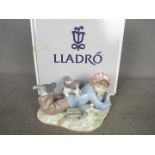 Lladro - A boxed figural group entitled Study Buddies, # 5451, approximately 10 cm (h).