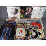 A collection of vinyl records 7" and 12" to include Deep Purple, The Rolling Stones, John Lennon,