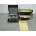 Pitmans Swiss Typewriter with Hellioue typewriting course book. Vintage. Case is 33cm wide.