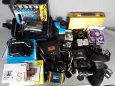 Photography - A quantity of cameras and photographic equipment to include Canon, Praktica,