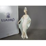 Lladro - A boxed figurine entitled Sophisticate, # 5787, approximately 26 cm (h).