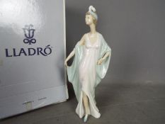 Lladro - A boxed figurine entitled Sophisticate, # 5787, approximately 26 cm (h).