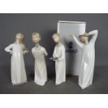 Lladro - Four Lladro figurines, one boxed, to include 'Boy Awaking', 'Girl With Candle' and similar,
