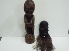 Two wooden Tribal carvings. Tallest is 70cm high.