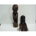 Two wooden Tribal carvings. Tallest is 70cm high.