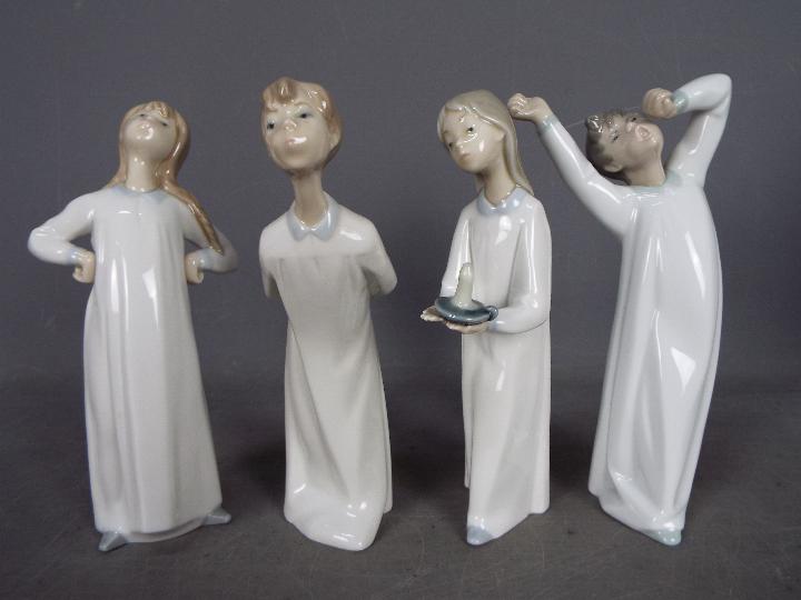 Lladro - Four Lladro figurines, one boxed, to include 'Boy Awaking', 'Girl With Candle' and similar, - Image 2 of 4