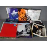 Approximately eighty 12" vinyl records to include Echo & The Bunnymen, David Bowie,