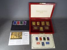 Coronation 25th anniversary commemorative issue of seven replica stamps, sterling silver gilt,