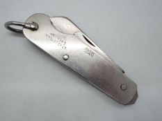 A military knife marked H.M.S.