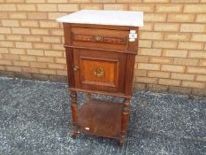A mahogany commode with marble top,