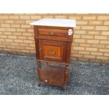 A mahogany commode with marble top,