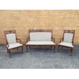 A good clean upholstered mahogany three-piece suite, the sofa 114 cm (h) x 145 cm (w) x 61 cm (d),