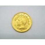 Gold Coin - A Persian one Pahlavi coin, approximately 8.2 grams all in.