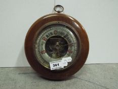 Circular Barometer. 18 cm diameter including wooden case.